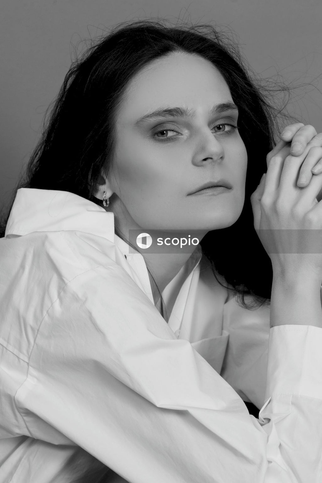 Woman in white button up shirt