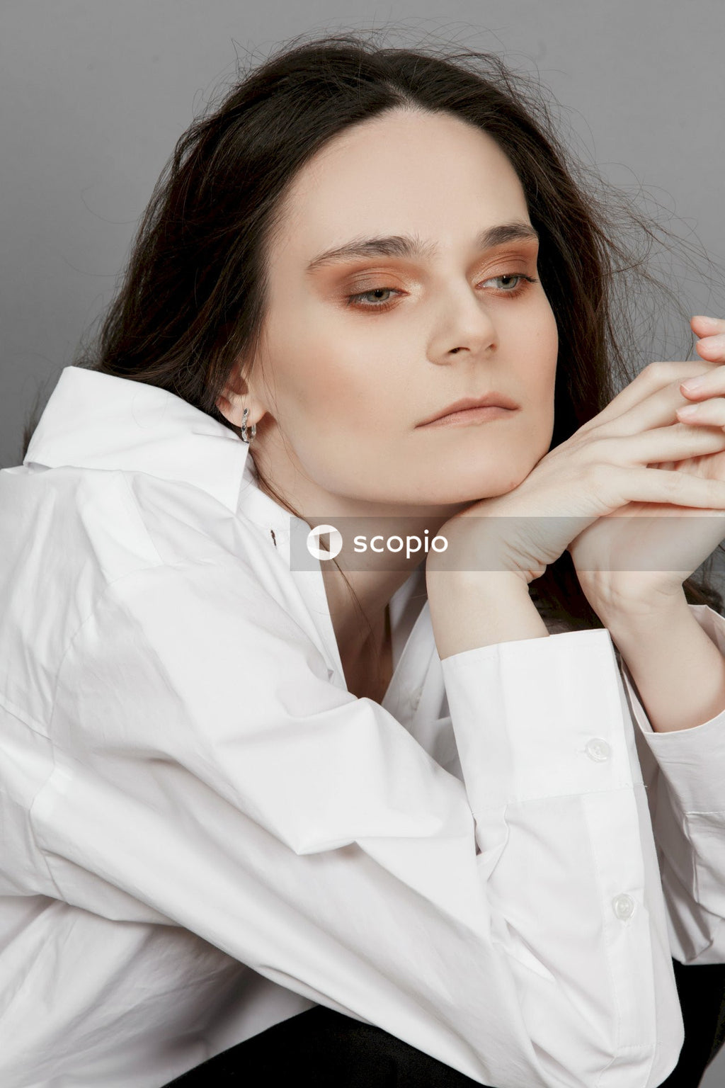 Woman in white button up shirt