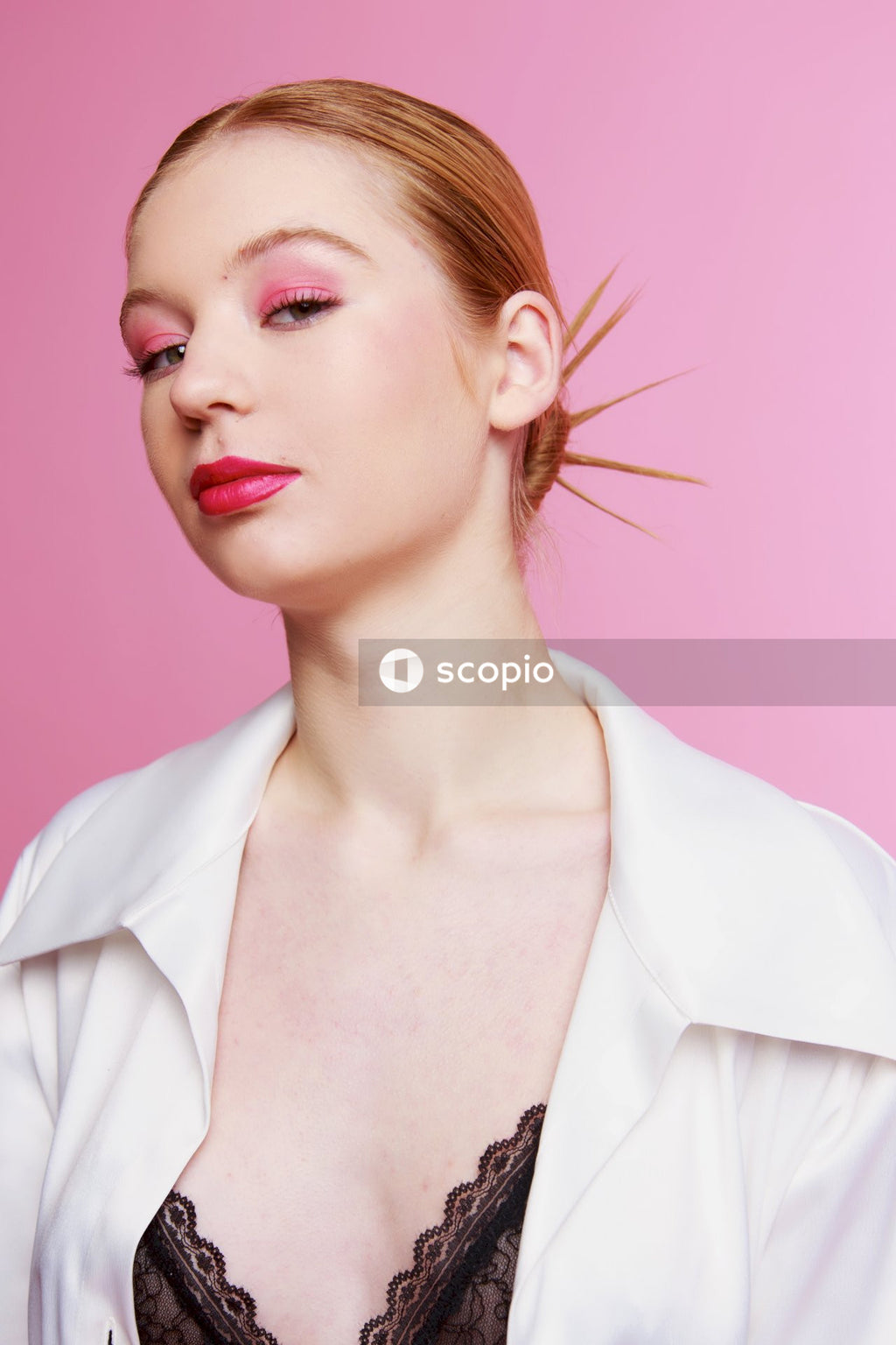 Woman in white collared shirt