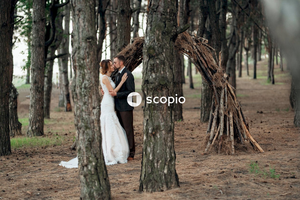 Woman in white dress hugging woman in black dress