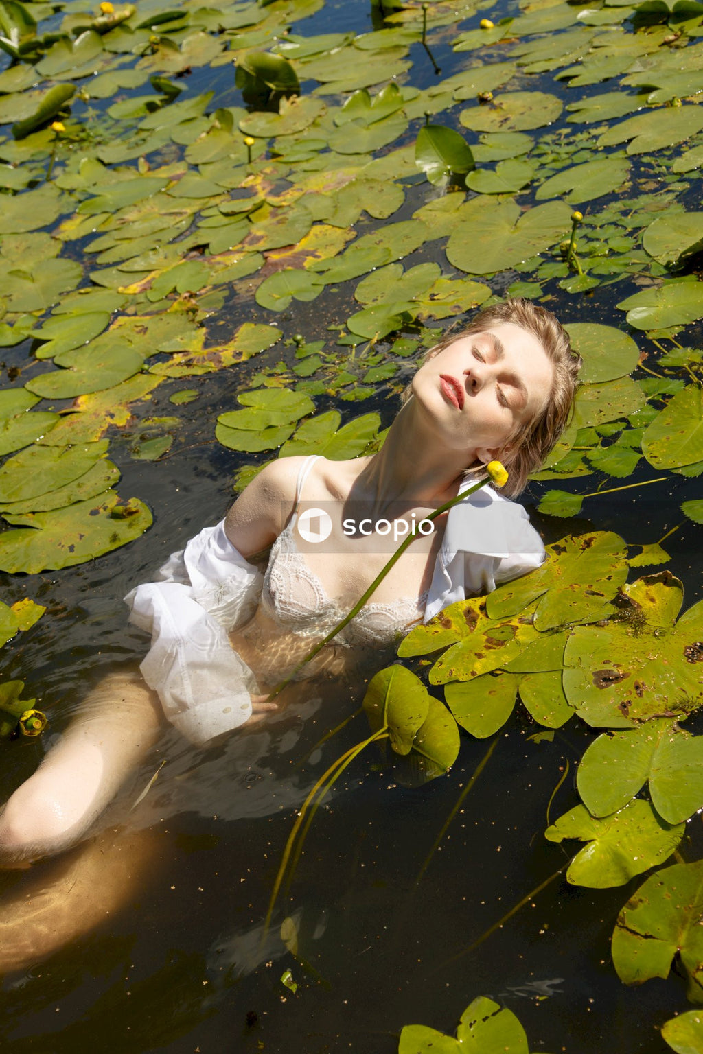Woman in white dress on water