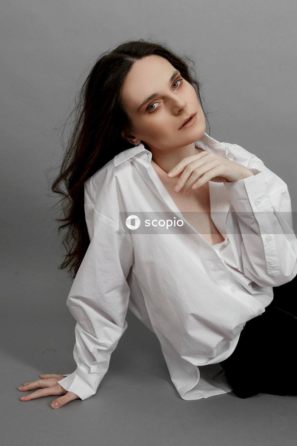 Woman in white dress shirt