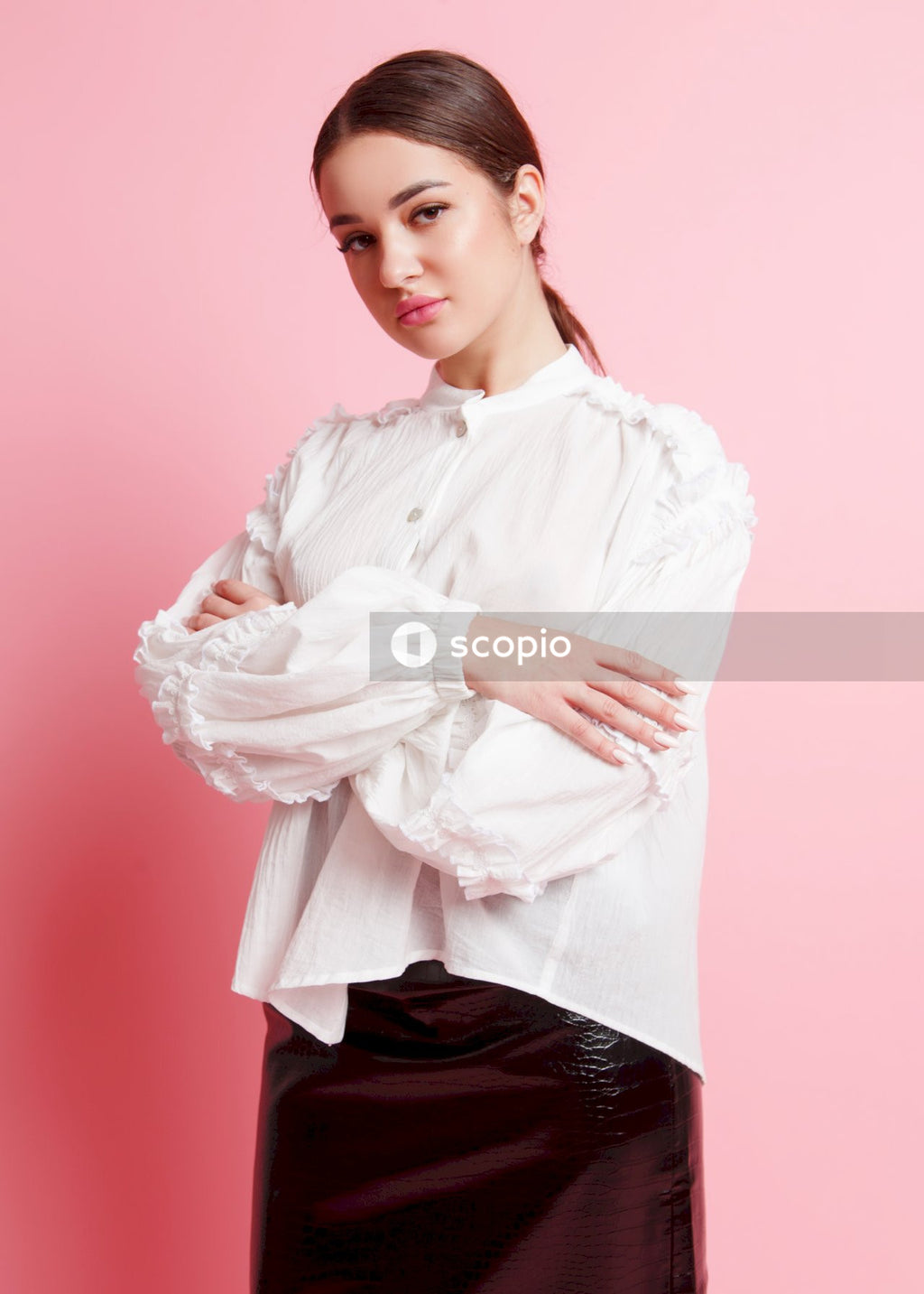 Woman in white dress shirt and black skirt
