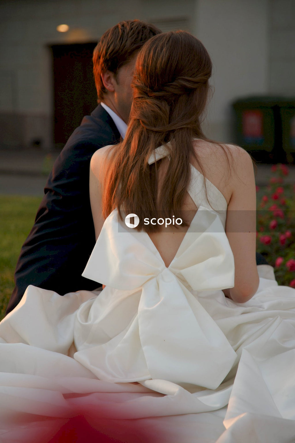 Back view of bride and groom sitting