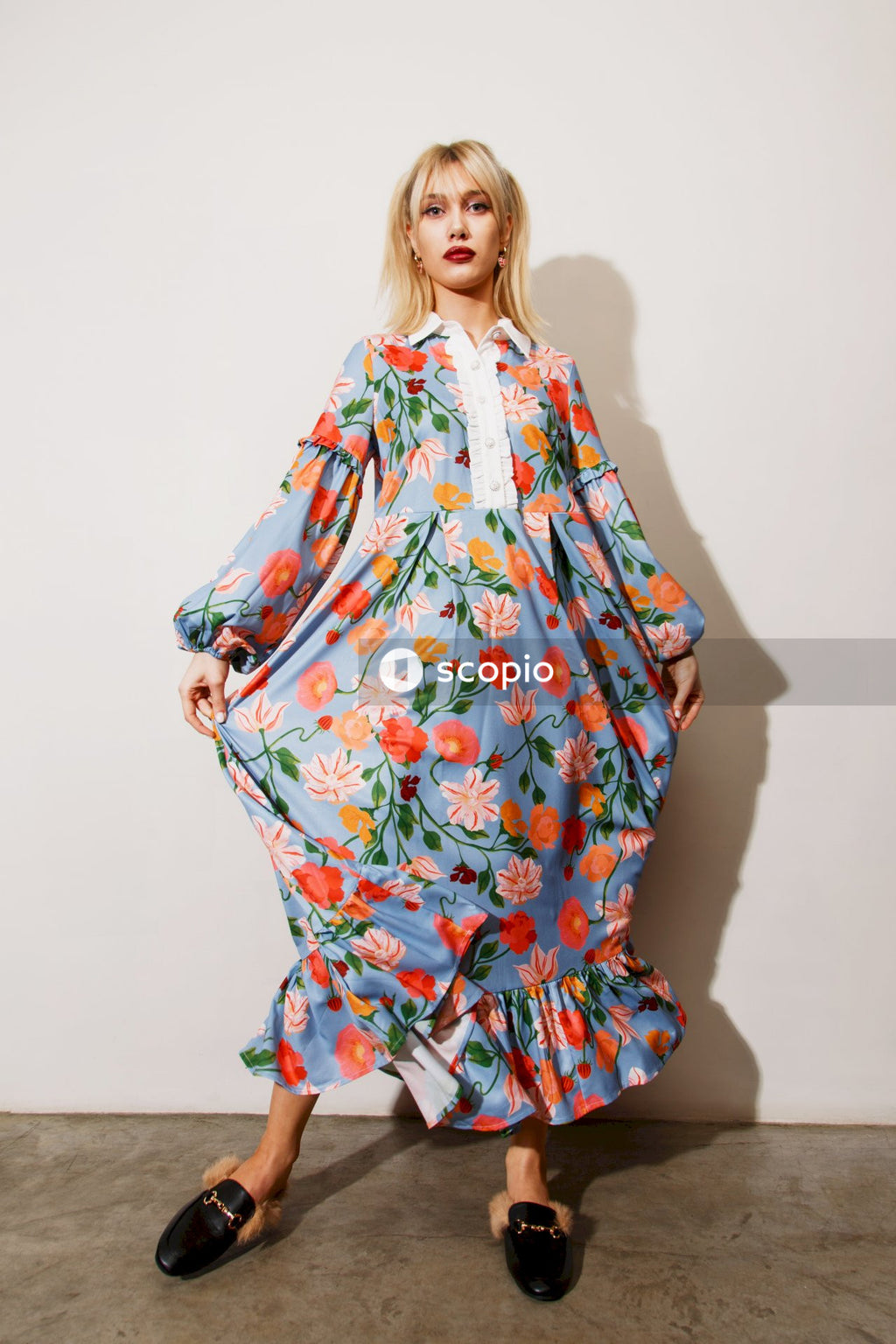 Woman in white green and red floral dress