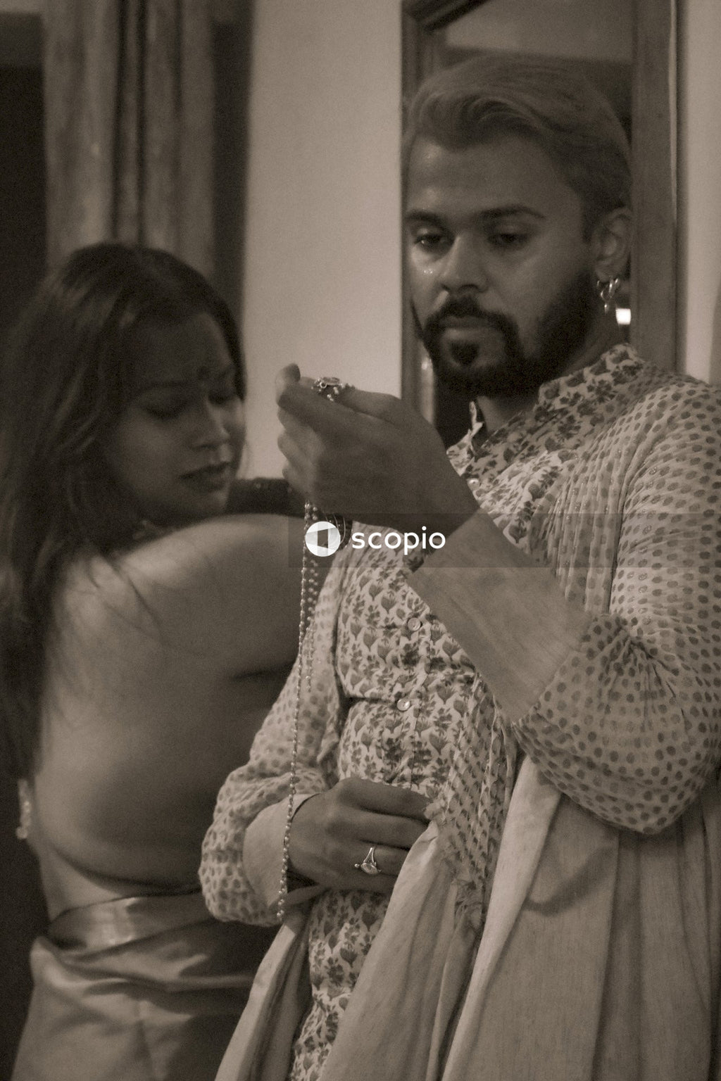 Grayscale photo of Indian man and woman
