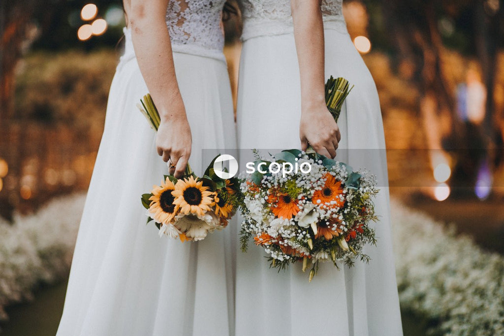 Two brides kissing at their wedding