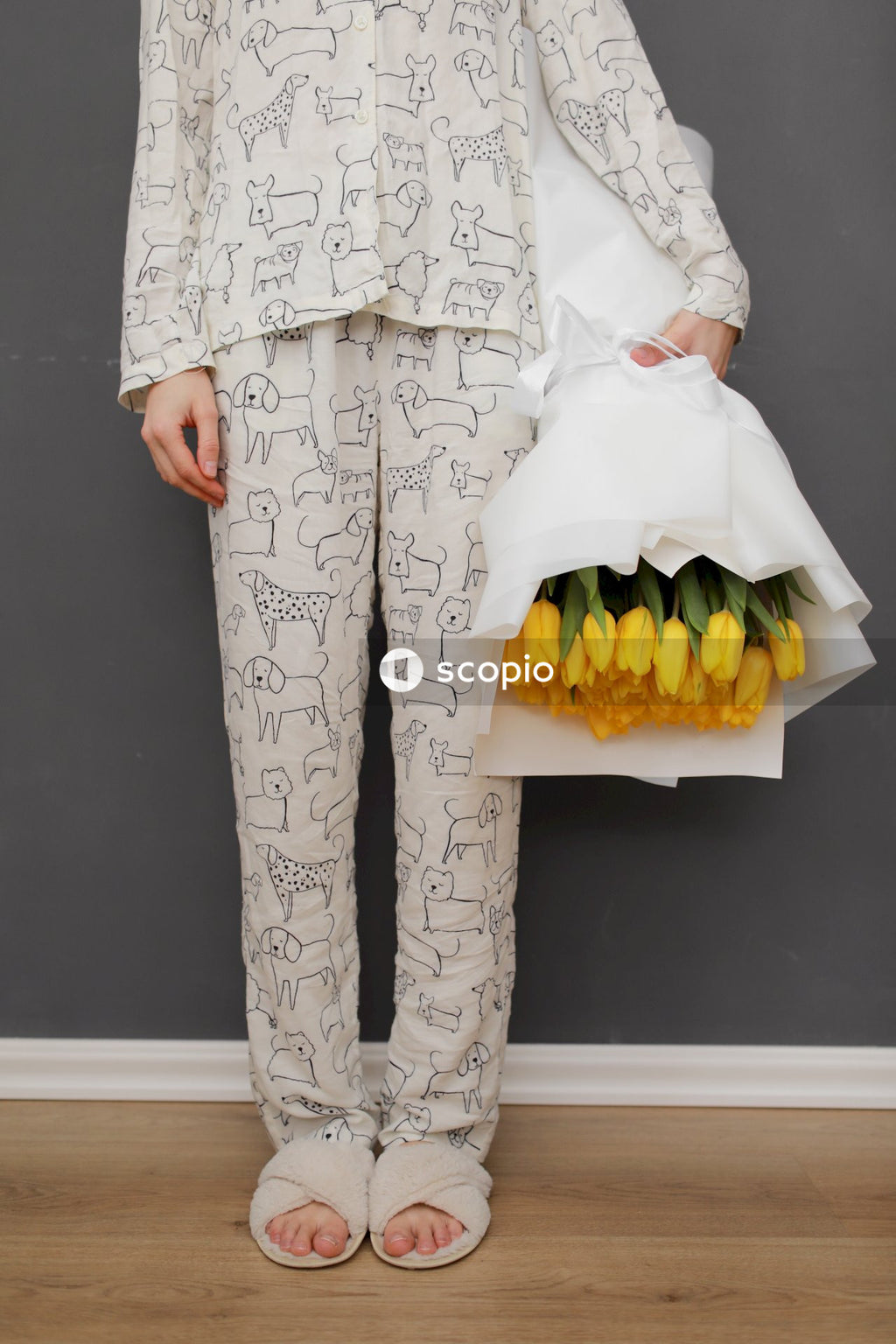 Woman in white long sleeve dress holding bouquet of flowers