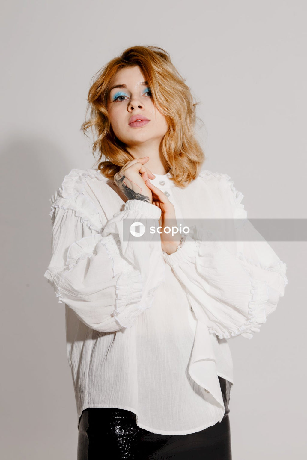 Woman in white long sleeve shirt