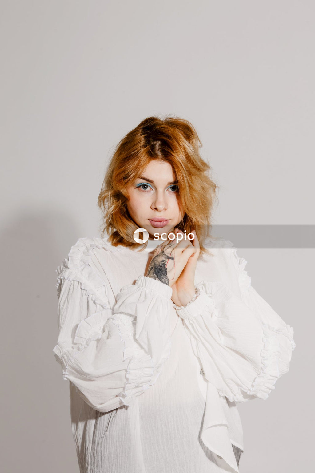 Woman in white long sleeve shirt