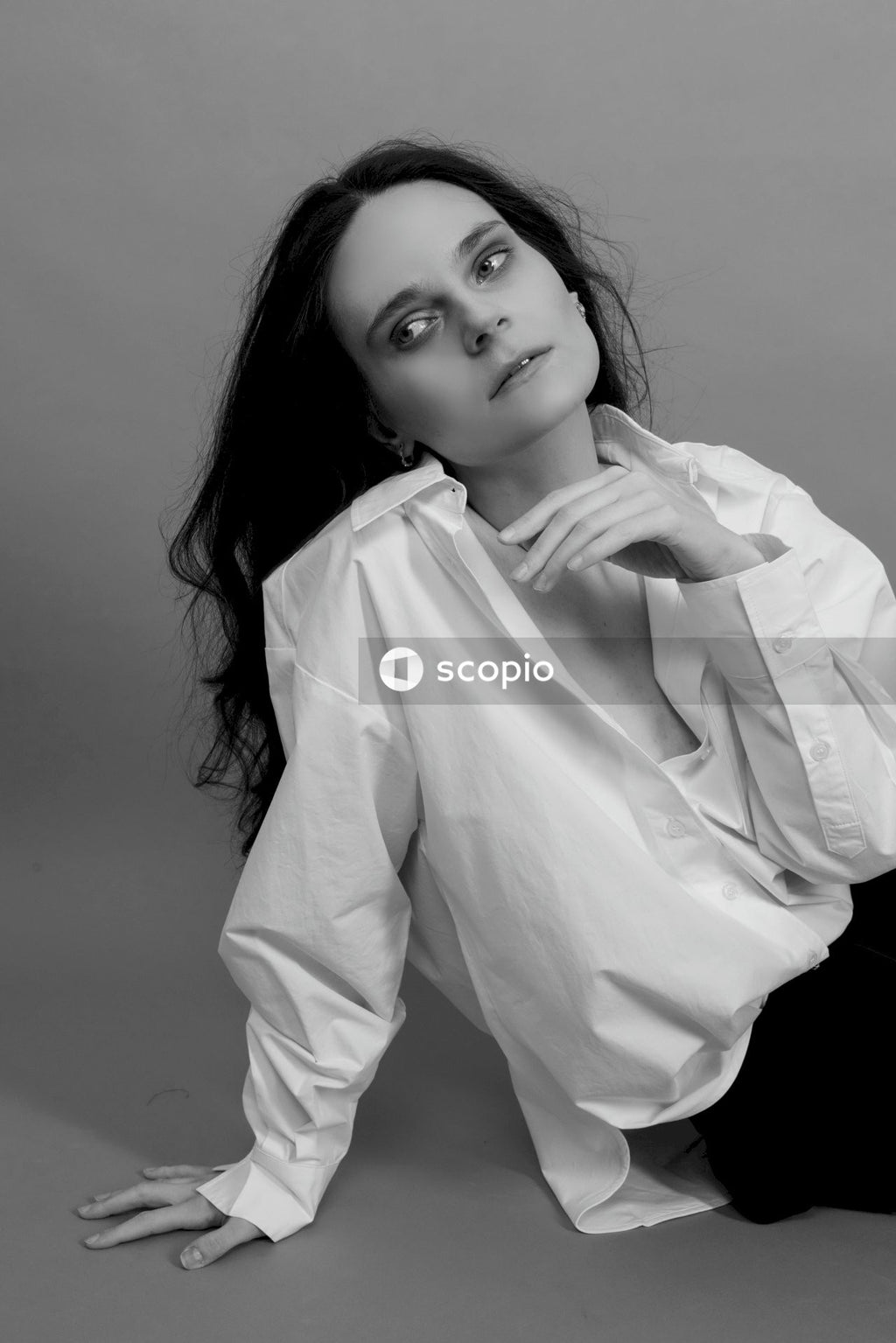 Woman in white long sleeve shirt
