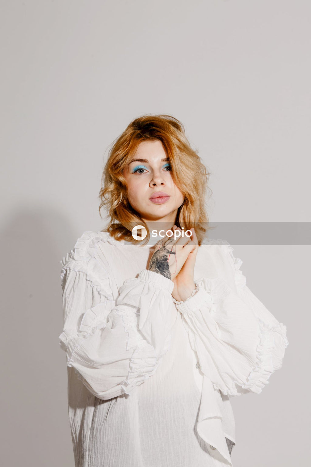 Woman in white long sleeve shirt