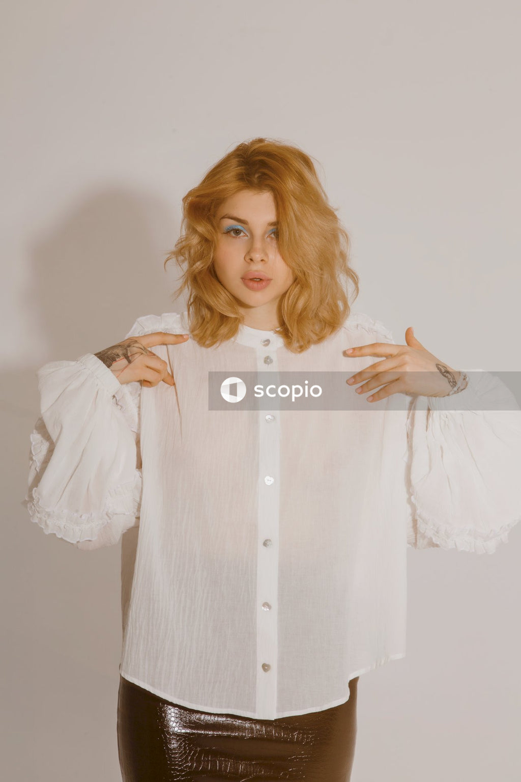 Woman in white long sleeve shirt