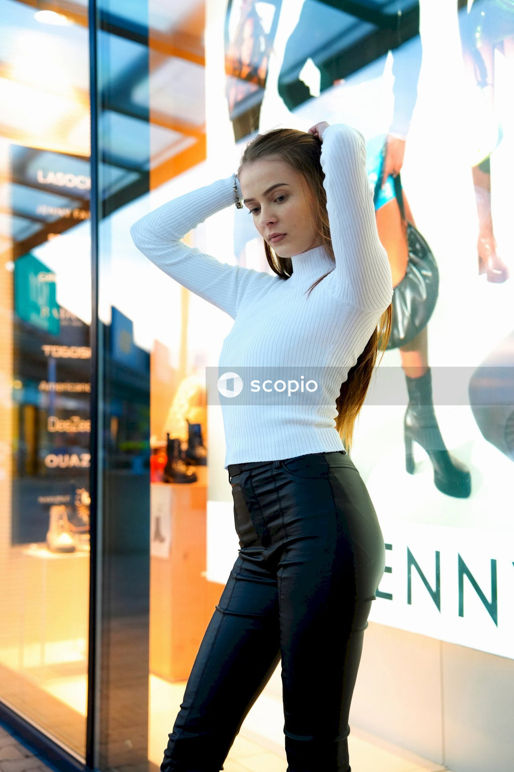 Woman in white long sleeve shirt and black pants