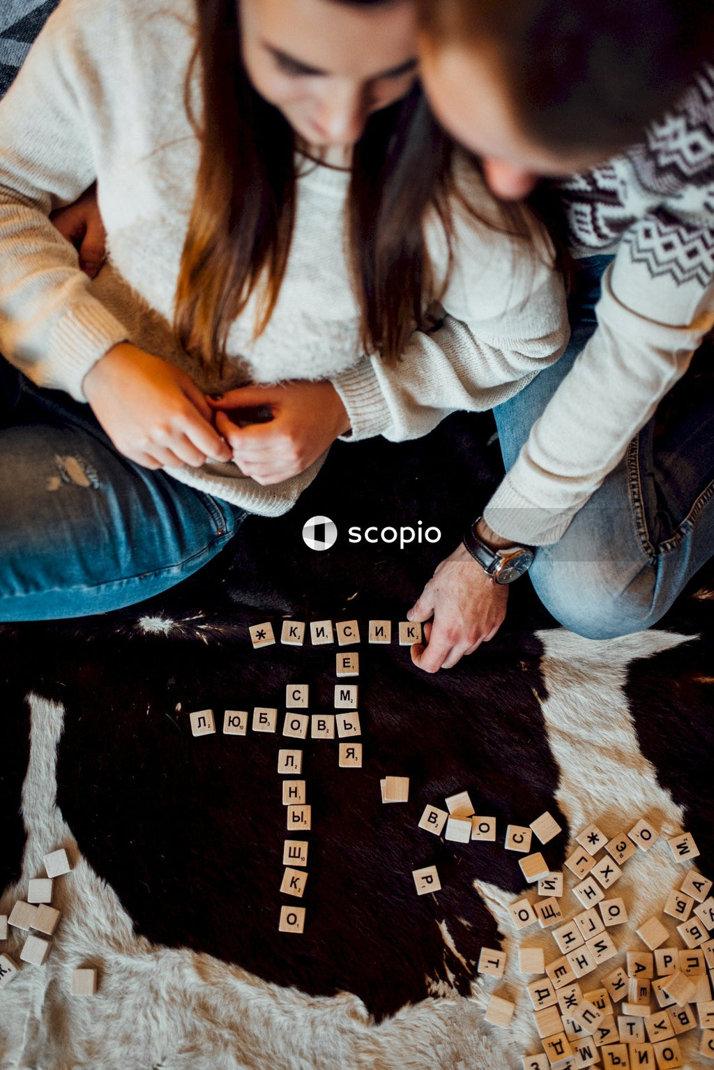 Top view of man and woman playing crosswords