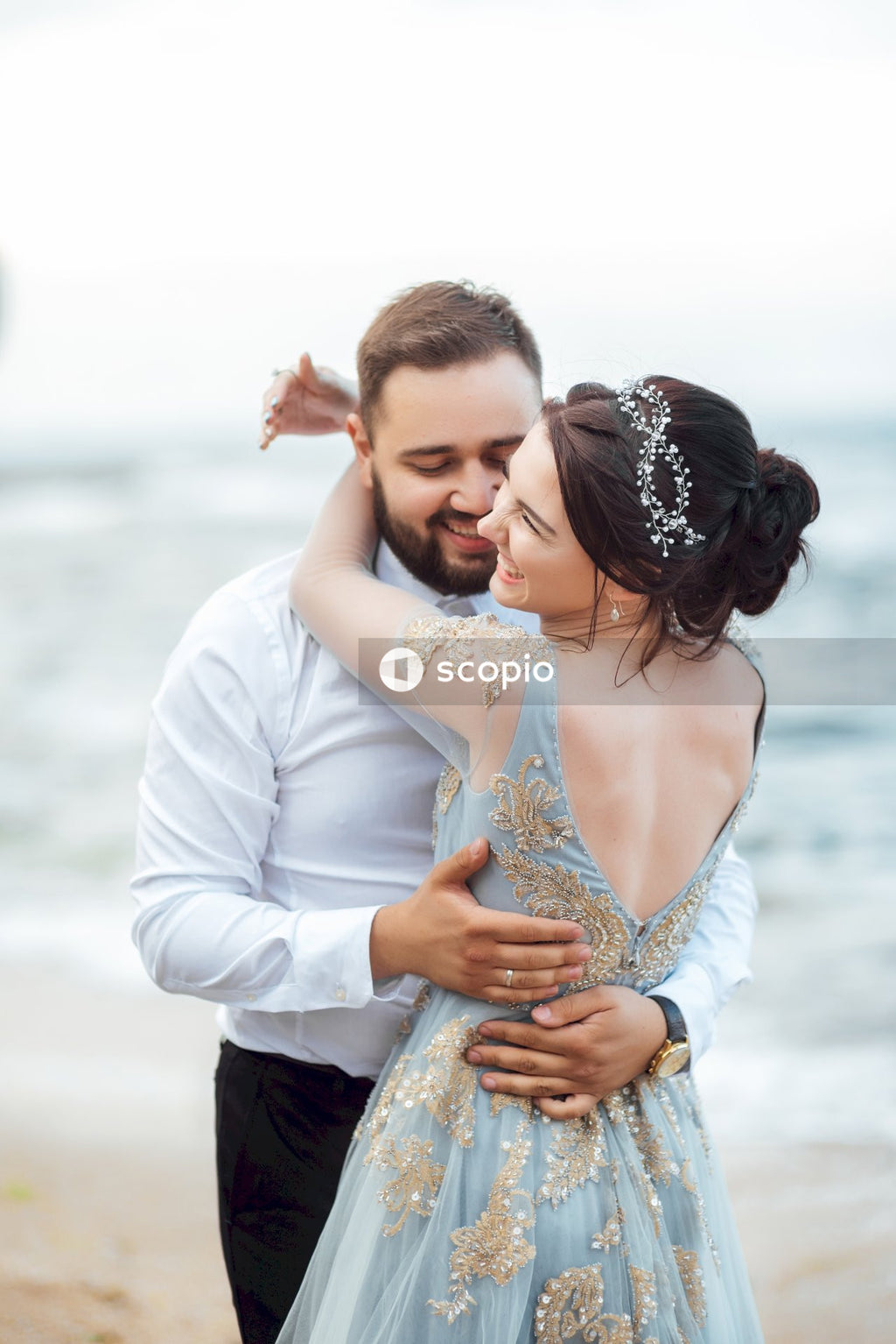 Woman in white long sleeve shirt hugging woman in white long sleeve shirt