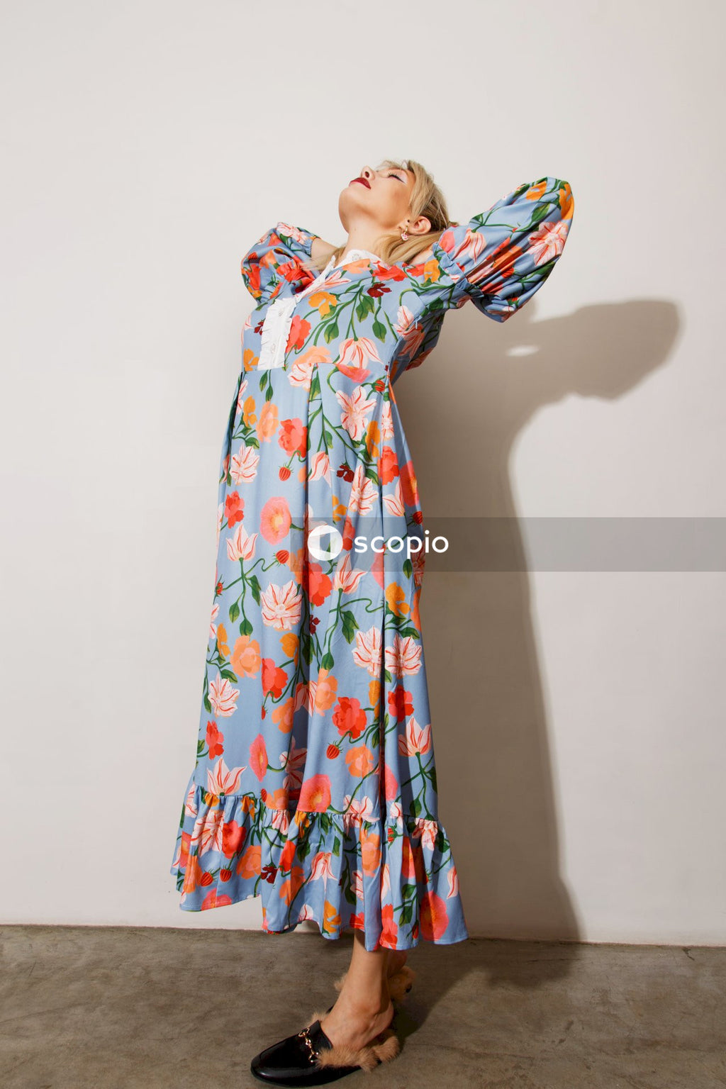 Woman in white red and blue floral hijab