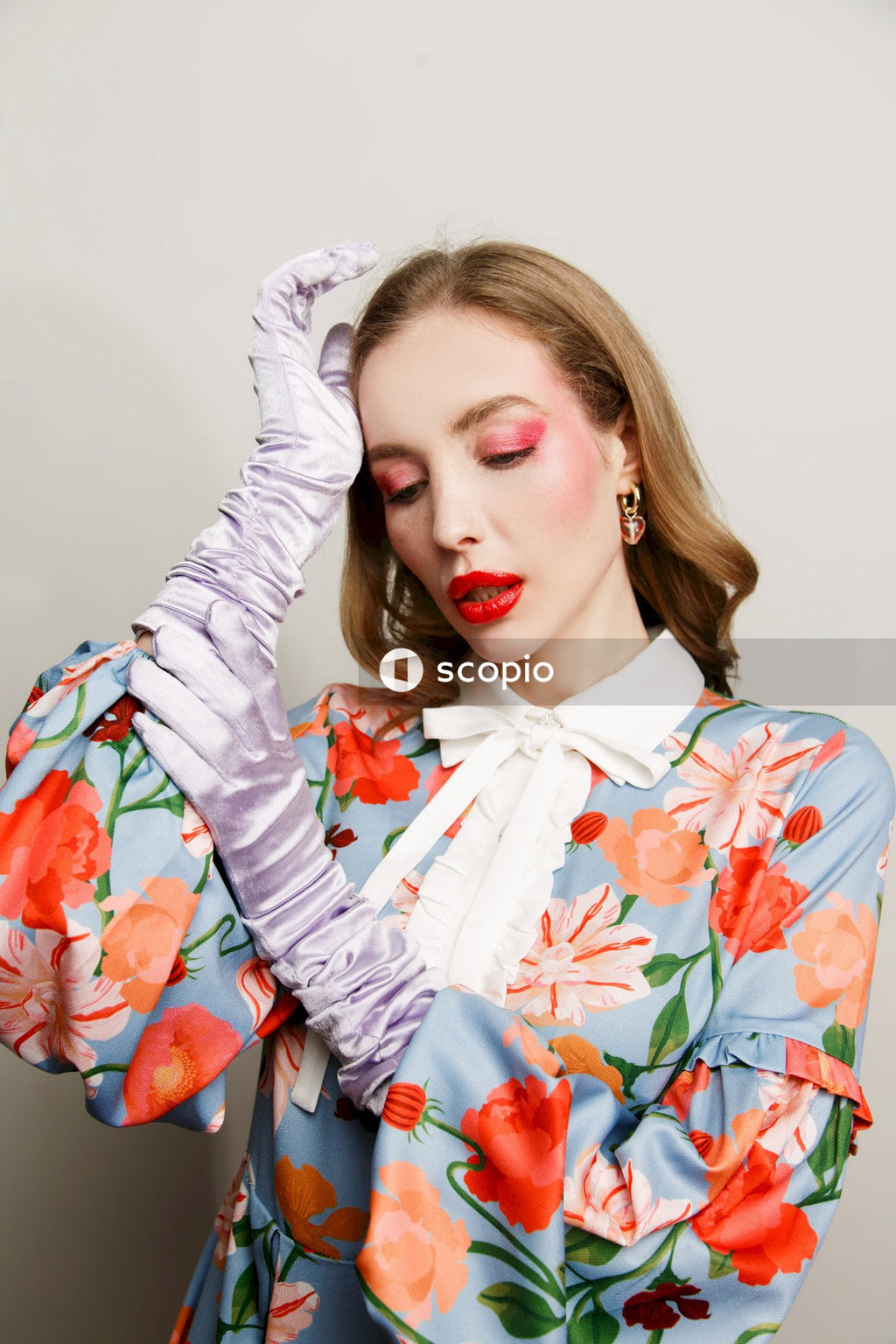 Woman in white red and blue floral long sleeve shirt