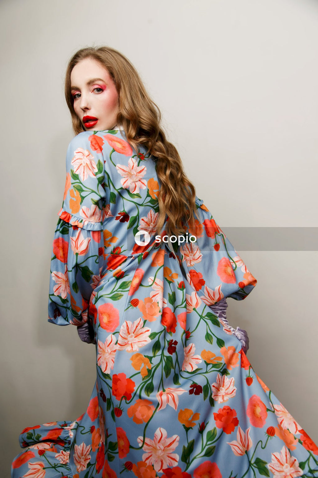 Woman in white red and green floral robe
