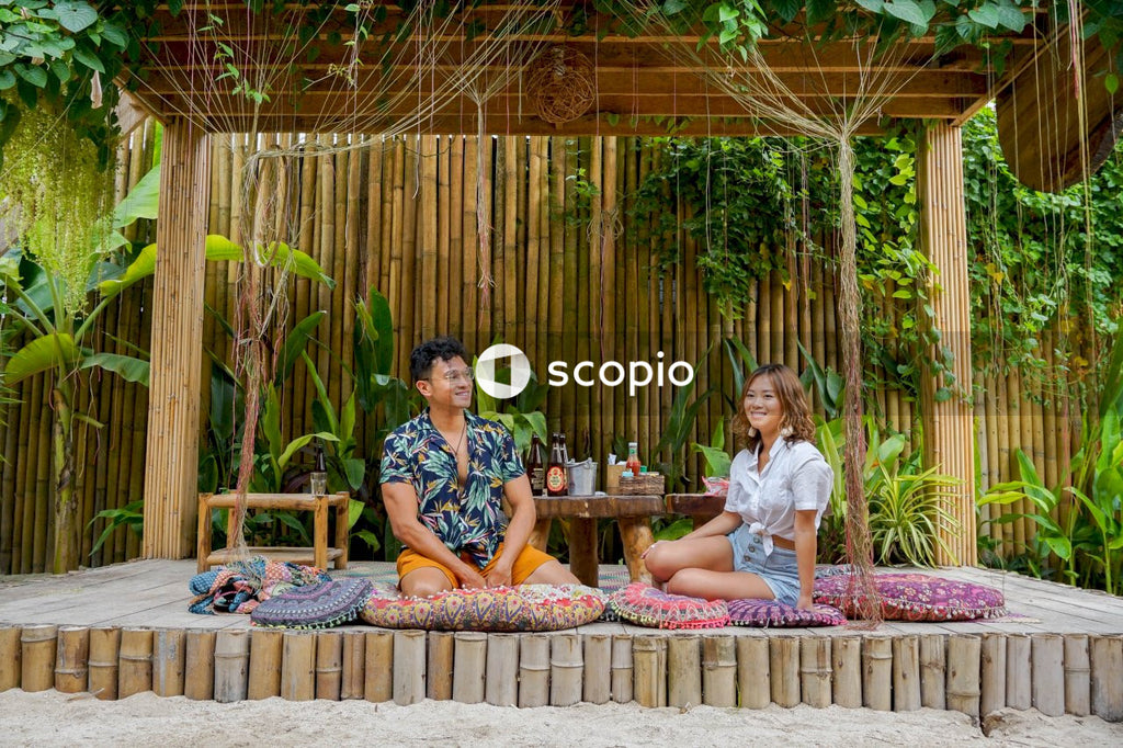 Man and woman on a date in a wooden gazebo