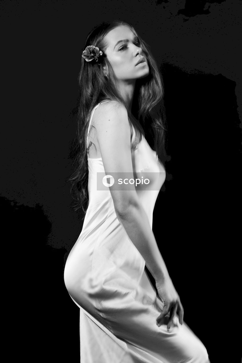 Woman in white spaghetti strap dress