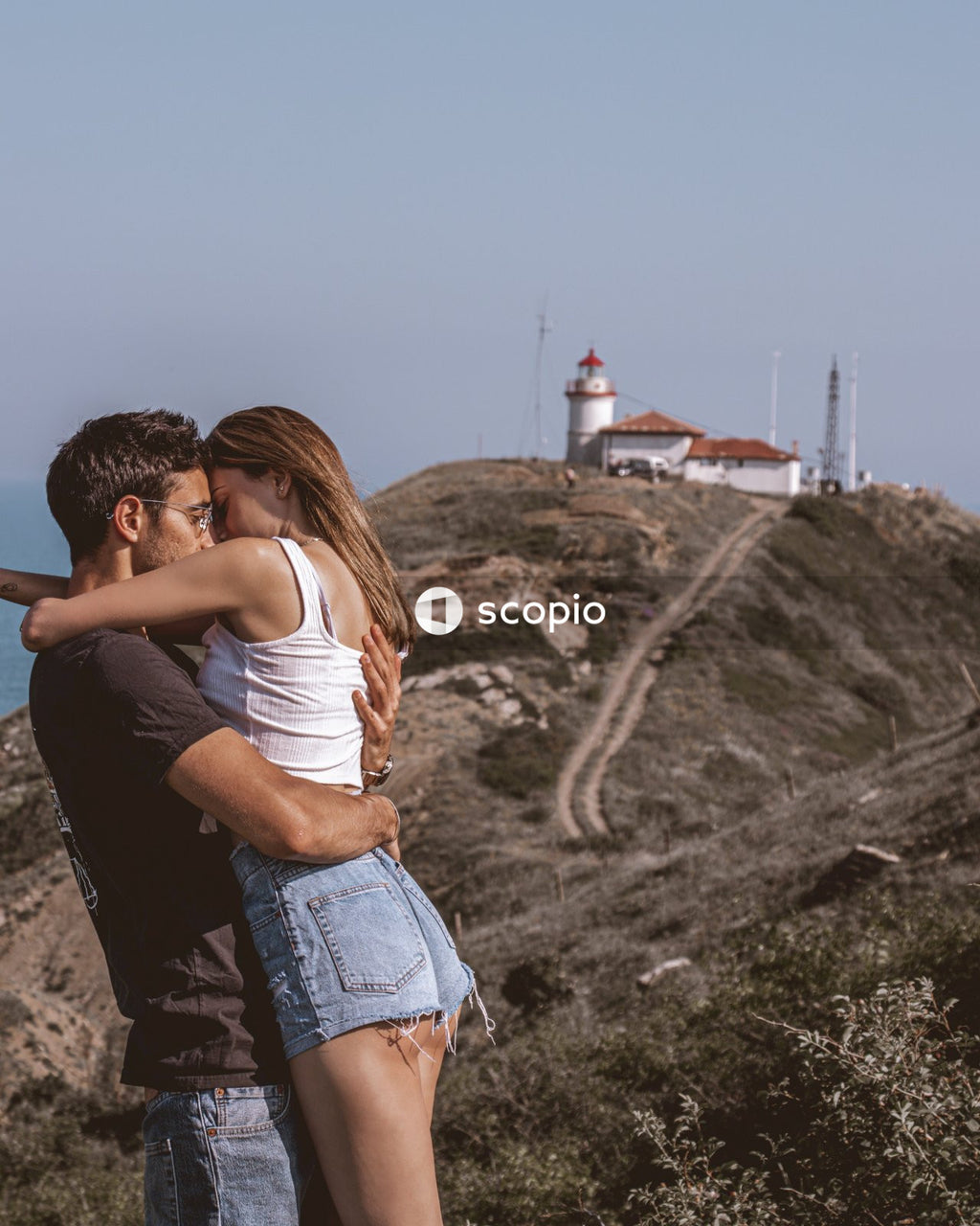 Young couple kissing near lighthouse in Bulgaria