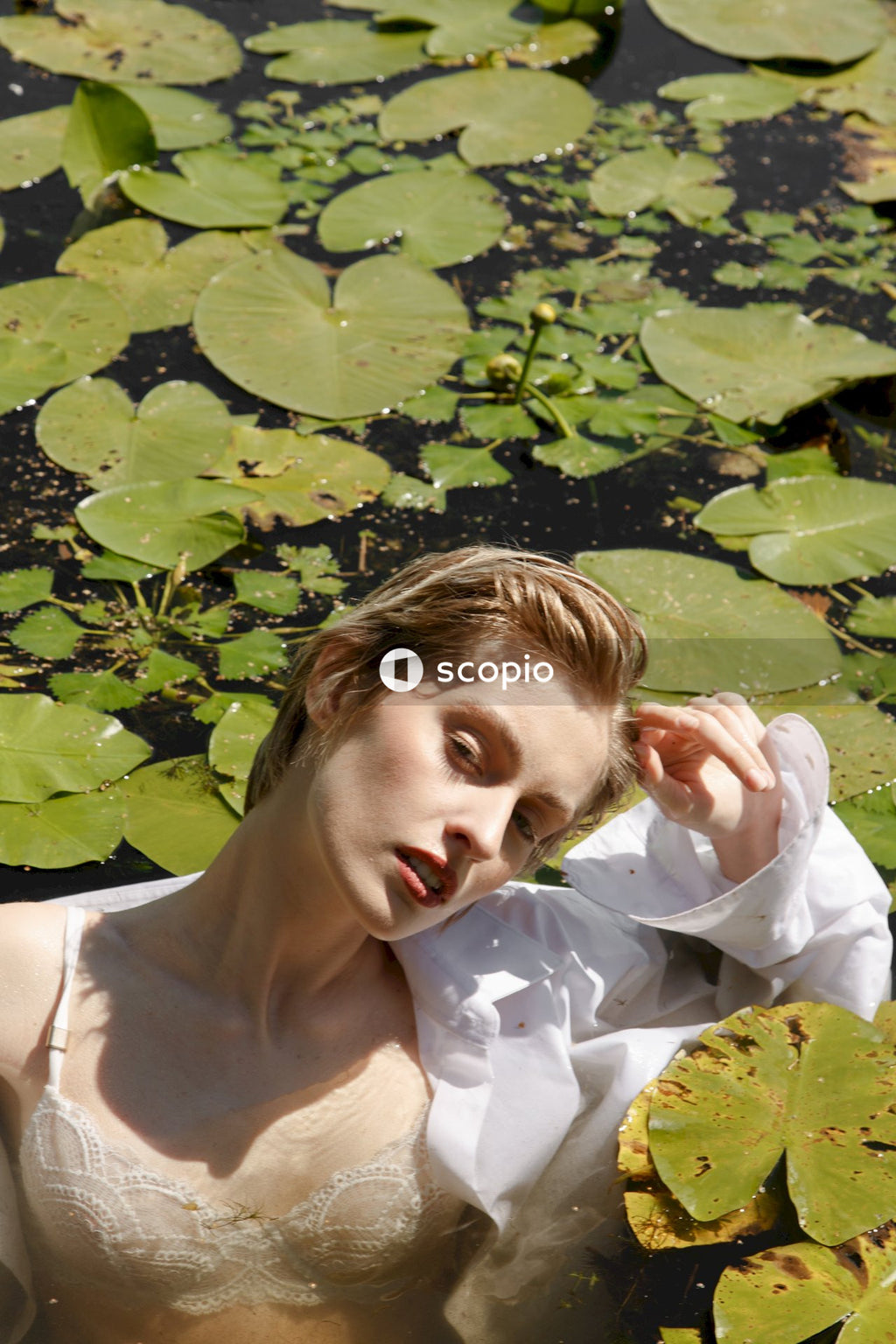 Woman in white tank top on water