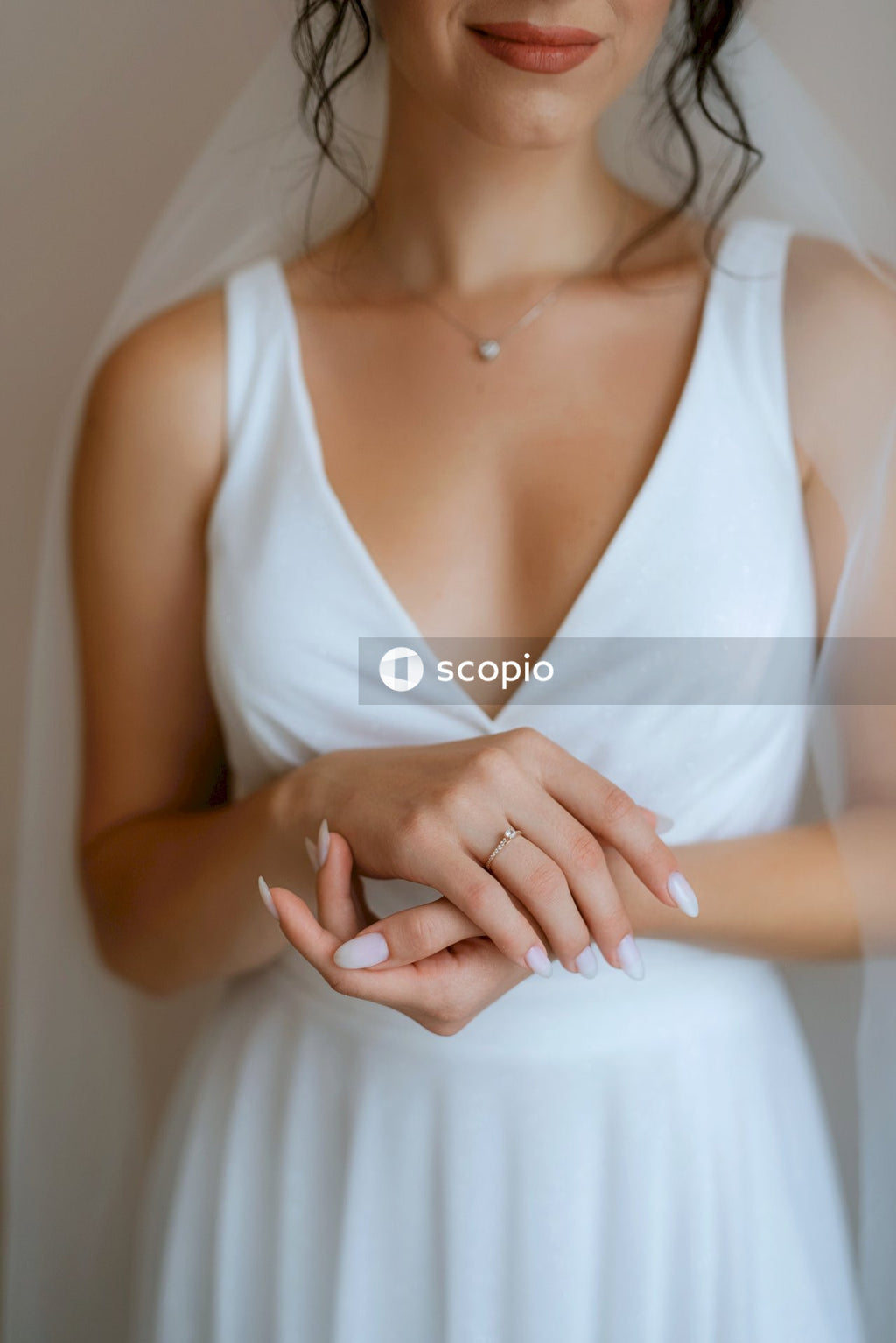 Woman in white v neck sleeveless dress