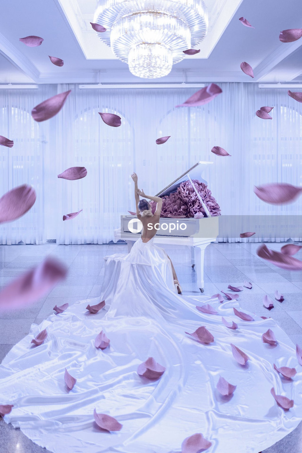 Woman in white wedding dress holding bouquet of flowers