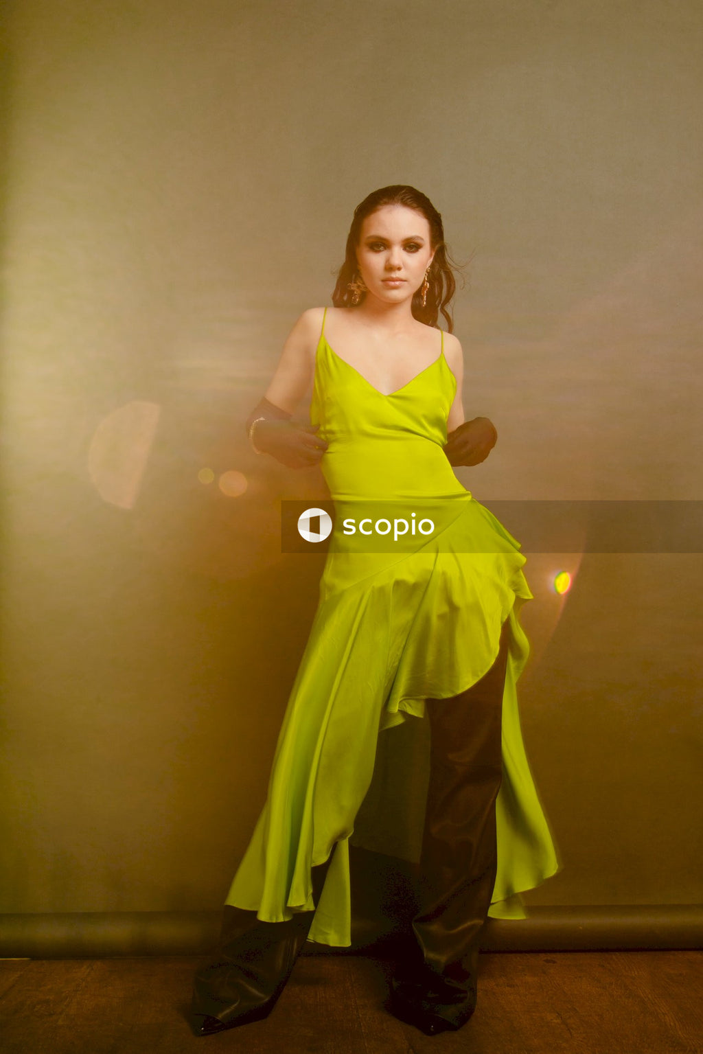 Woman in yellow sleeveless dress