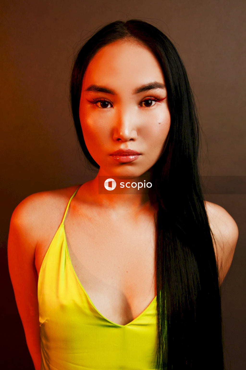 Woman in yellow spaghetti strap top