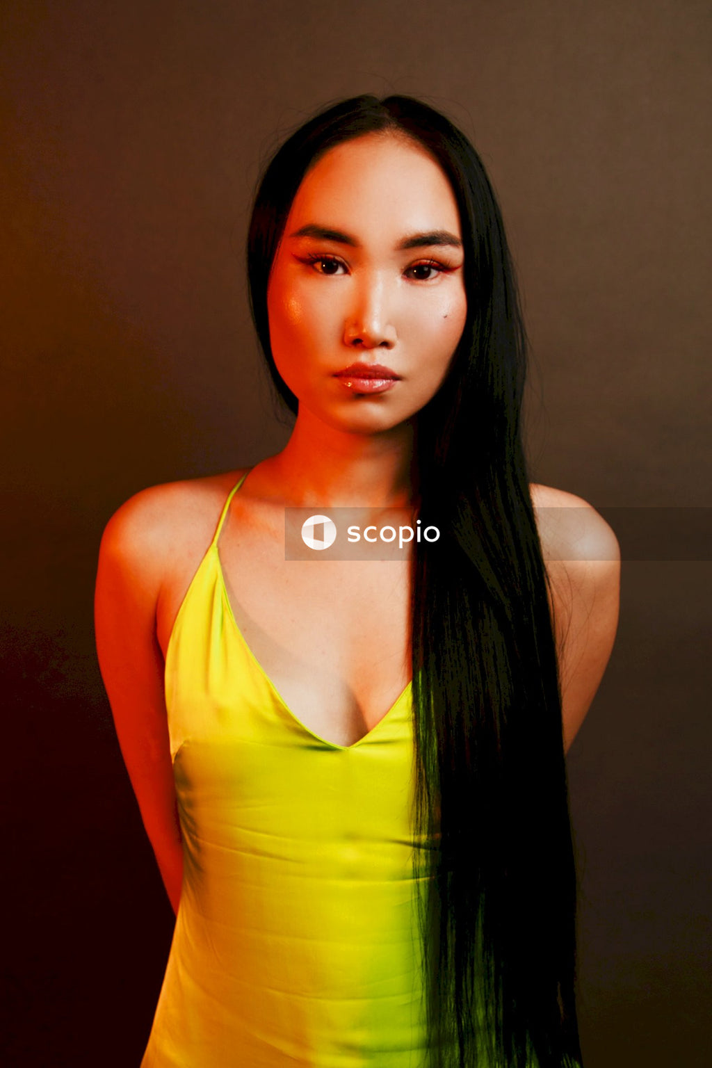 Woman in yellow spaghetti strap top