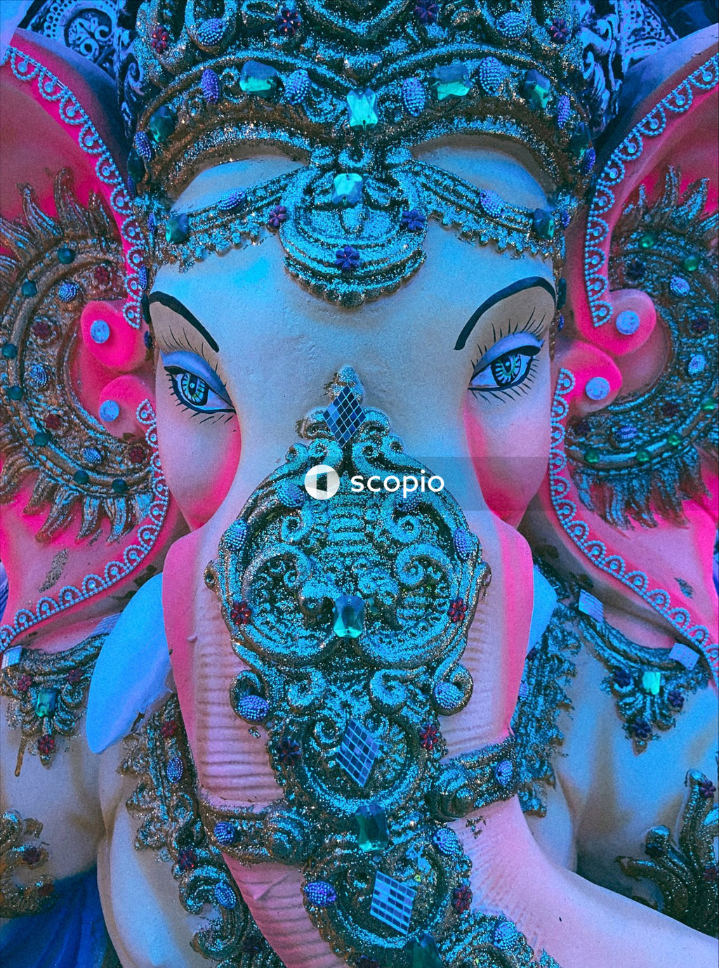Woman with blue and pink face paint