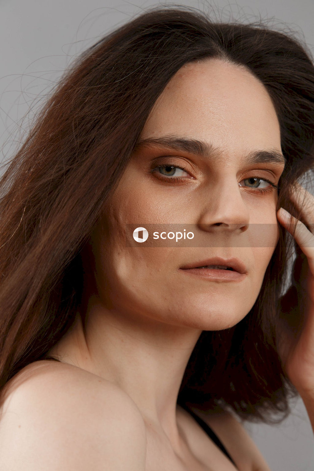 Woman with brown hair and black eyes