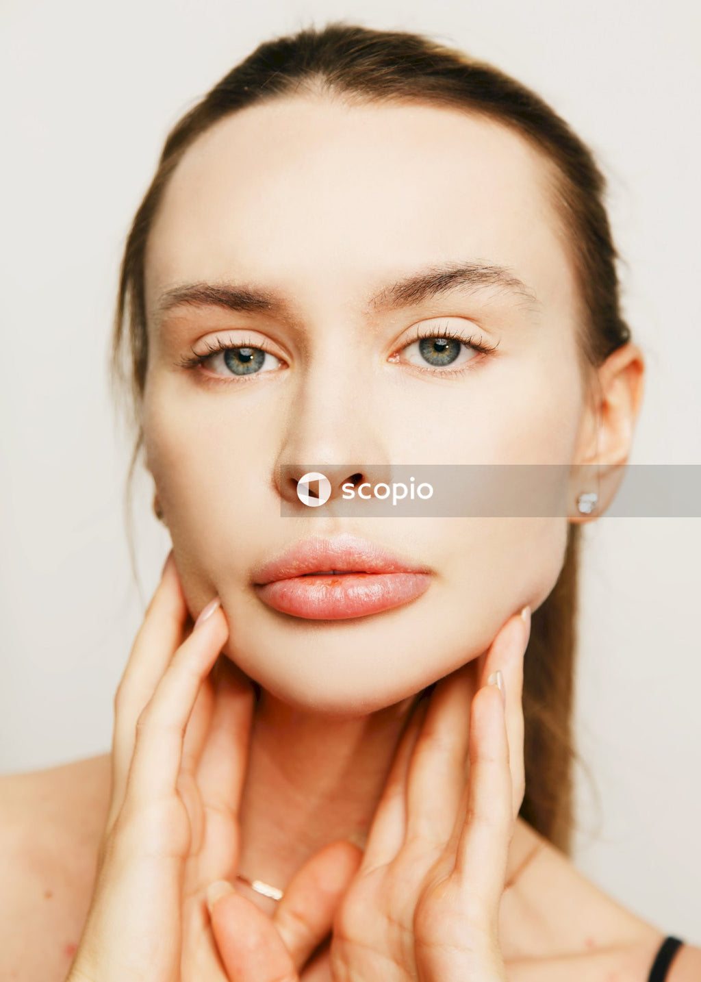 Woman with brown hair and red lipstick