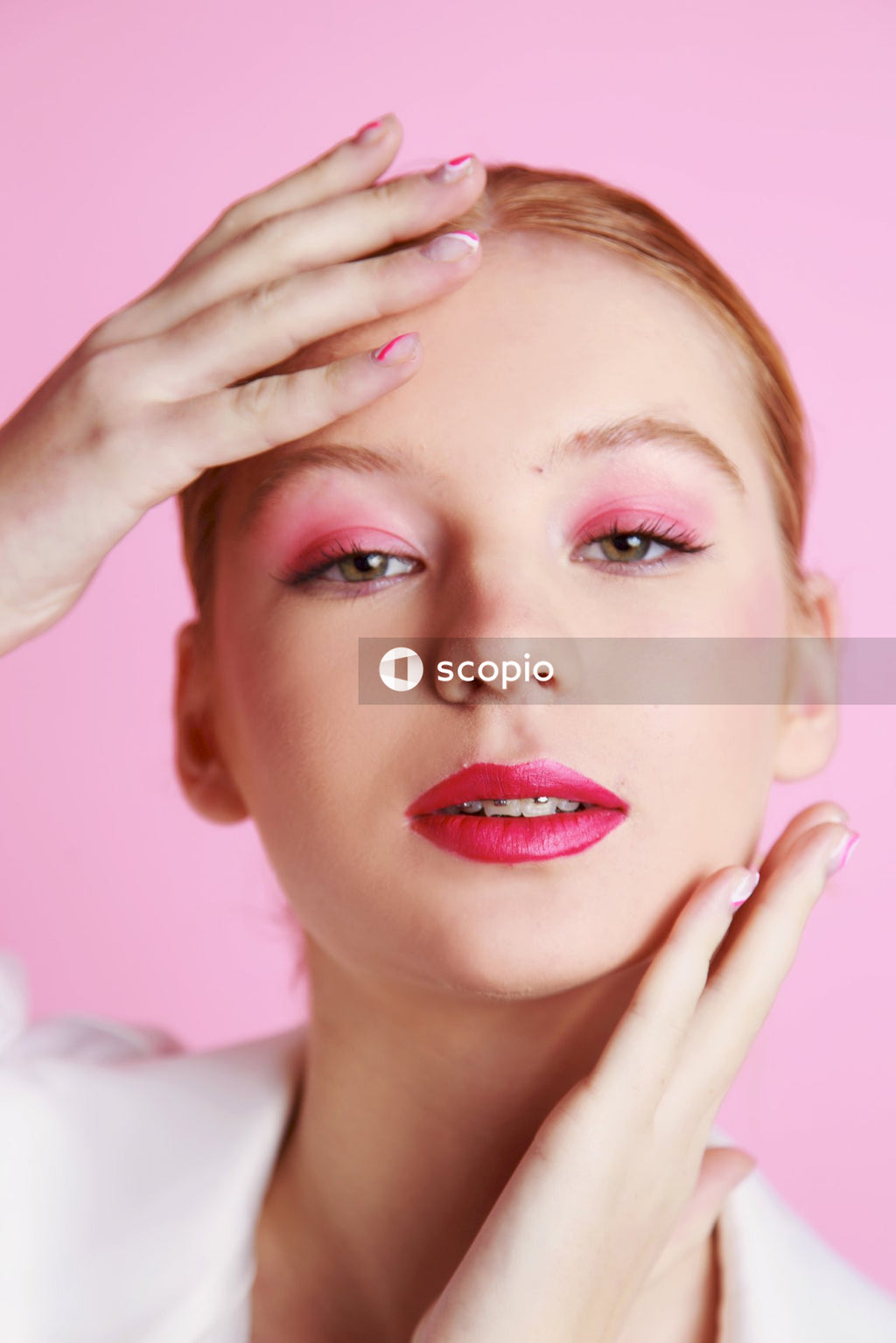 Woman with red lipstick and white shirt