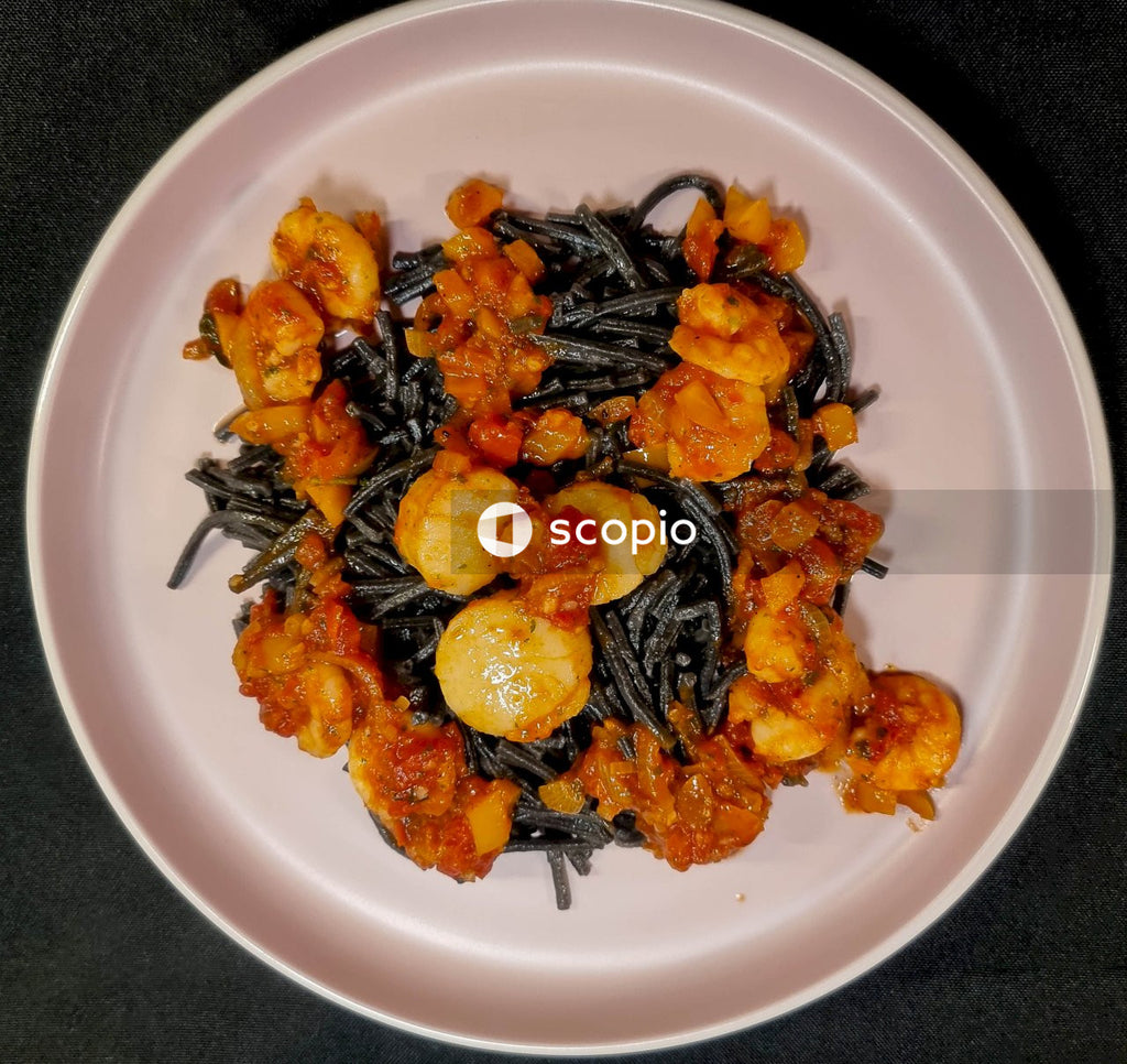 Yellow and black fruit on white ceramic plate