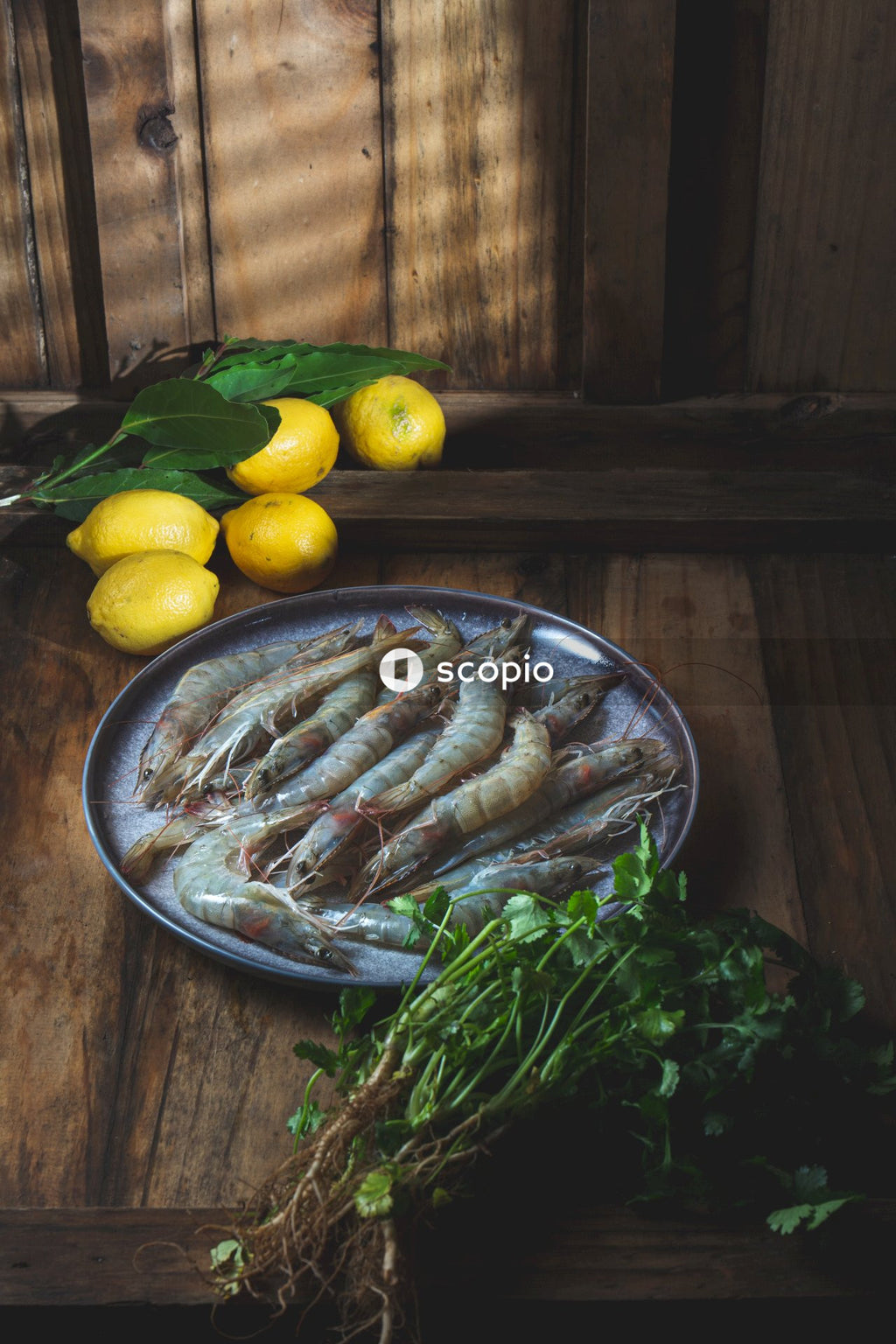 Yellow lemon fruit on stainless steel round plate