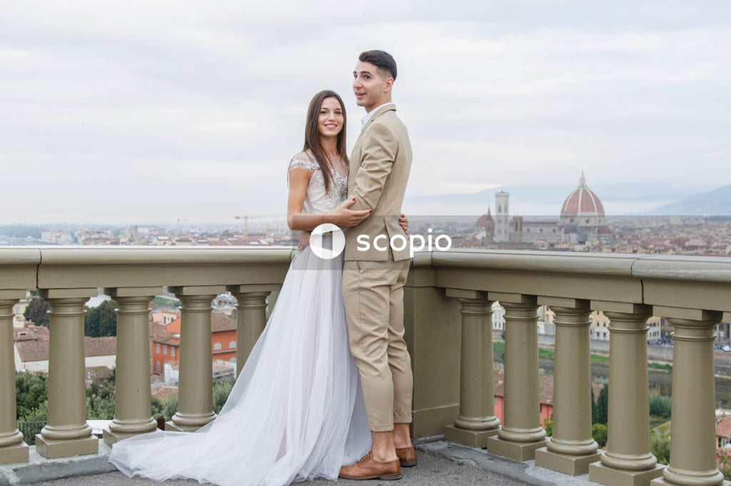 Young couple posing together on the streets in the city